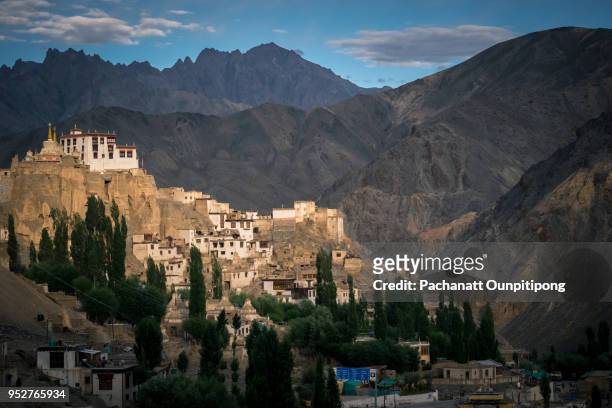 a view of lamayuru monastery with villages and having mountains background, lamayuru, ladakh, india - lamayuru monastery stock pictures, royalty-free photos & images