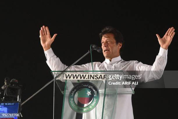 Pakistan opposition leader and leader of the Pakistani political party Pakistan Tehreek-e-Insaf Imran Khan delivers a speech during a political...