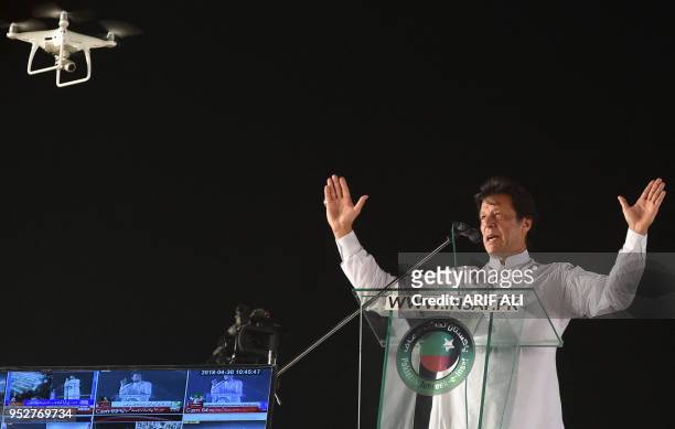 Pakistan opposition leader and leader of the Pakistani political party Pakistan Tehreek-e-Insaf Imran Khan delivers a speech during a political...
