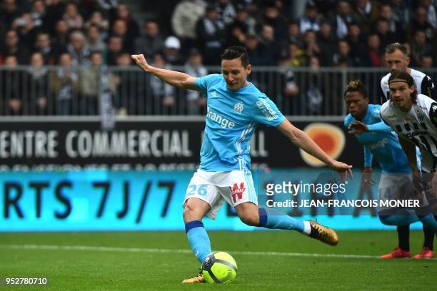 Marseille's French midfielder Florian Thauvin kicks a penalty during the French L1 football match between Angers and Marseille, on April 29 at...