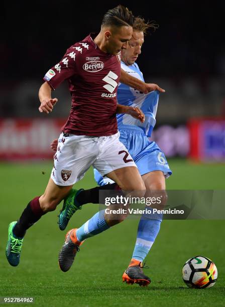 Simone Edera of Torino FC competes with Lucas Leiva Pezzini of SS Lazio during the Serie A match between Torino FC and SS Lazio at Stadio Olimpico di...