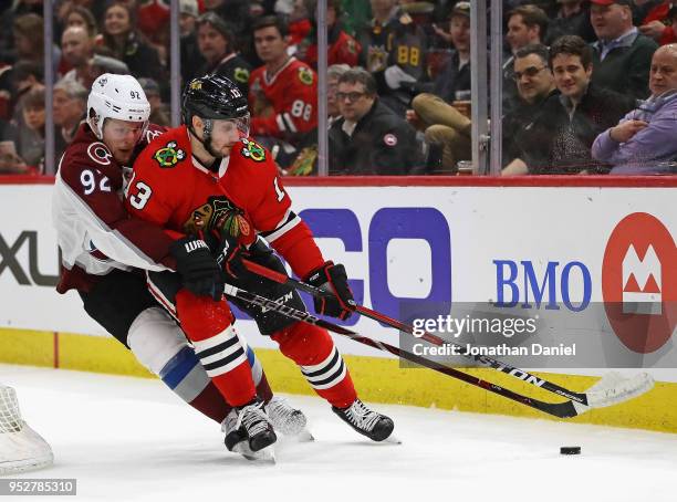 Tomas Jurco of the Chicago Blackhawks is pressured by Gabriel Landeskog of the Colorado Avalanche at the United Center on March 6, 2018 in Chicago,...