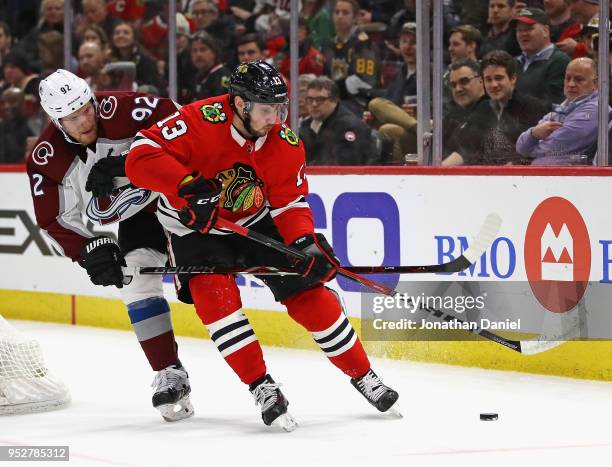 Tomas Jurco of the Chicago Blackhawks is pressured by Gabriel Landeskog of the Colorado Avalanche at the United Center on March 6, 2018 in Chicago,...