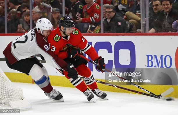 Tomas Jurco of the Chicago Blackhawks is pressured by Gabriel Landeskog of the Colorado Avalanche at the United Center on March 6, 2018 in Chicago,...