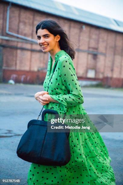 Model Irene Guarenas wears a green polkadot Ganni dress at Copenhagen Fashion Week Autumn/Winter 18 on February 01, 2018 in Copenhagen, Denmark..