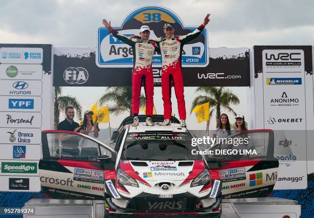 Estonian driver Ott Tanak and his compatriot co-driver Martin Jarveoja celebrate their win on the final podium of the Argentina World Rally...