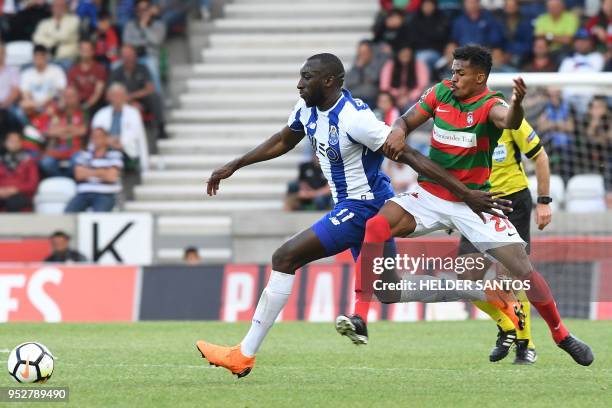 Porto's Malian forward Moussa Marega challenges Maritimo's Portuguese midfielder Joao Gamboa during the Portuguese league football match between...