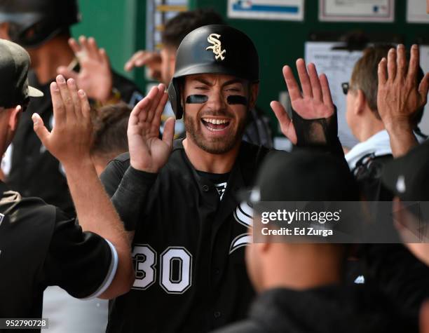 Nicky Delmonico of the Chicago White Sox celebrates with teammates after scoring on Daniel Palka's two-run double in the fourth inning against the...