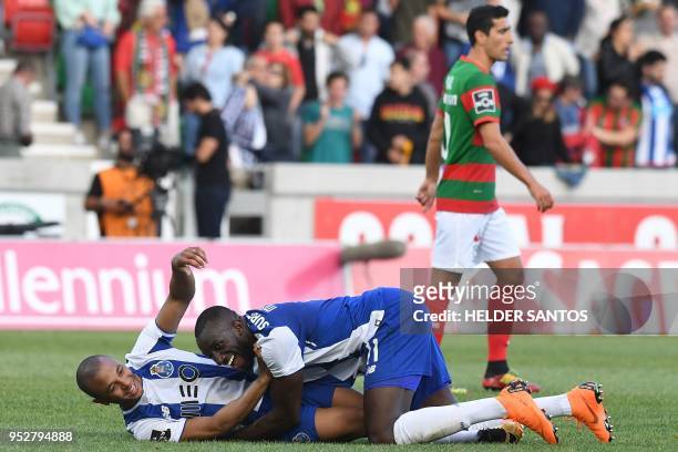 Porto's Algerian forward Yacine Brahimi celebrates with Porto's Malian forward Moussa Marega after the Portuguese league football match between...
