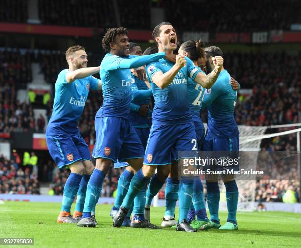 Granit Xhaka, Alex Iwobi and Calum Chambers celebrate the Arsenal goal, scored by Henrikh Mkhitaryan during the Premier League match between...