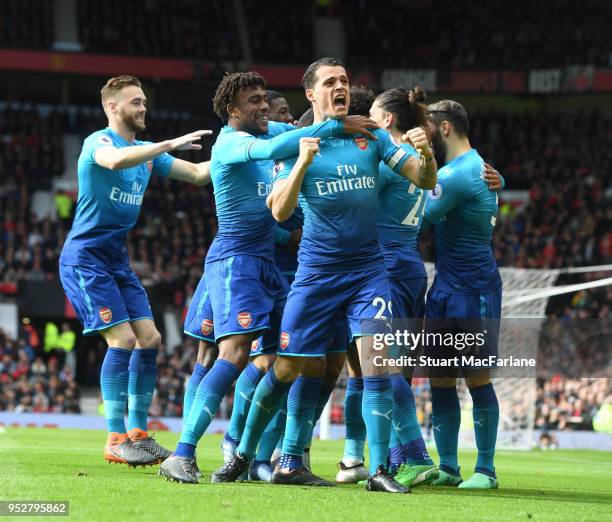 Granit Xhaka, Alex Iwobi and Calum Chambers celebrate the Arsenal goal, scored by Henrikh Mkhitaryan during the Premier League match between...