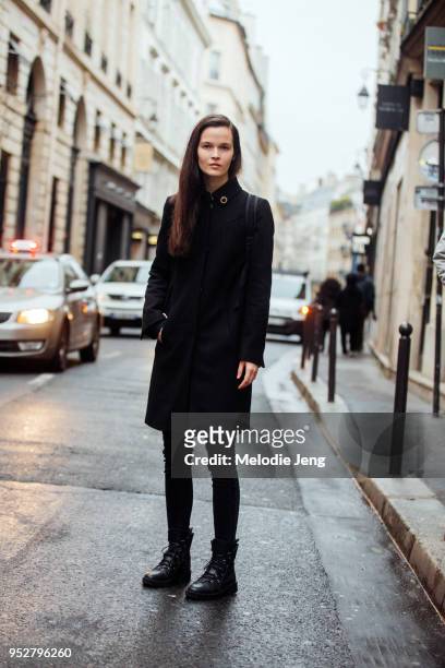 Model Runa Neuwirth on a long slim all black outfit and jacket on January 23, 2018 in Paris, France.