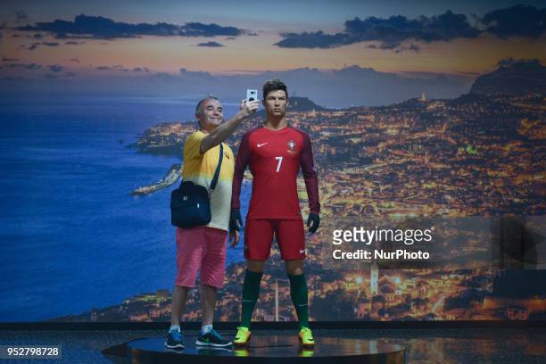 Visitor takes a selfie with a Cristiano Ronaldo waxwork inside the CR7 Museum located in Funchal seafront, on the island of Madeira, where Portuguese...