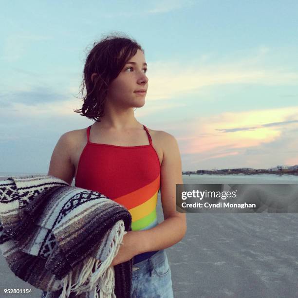 Girl in Rainbow Swimsuit at Sunset