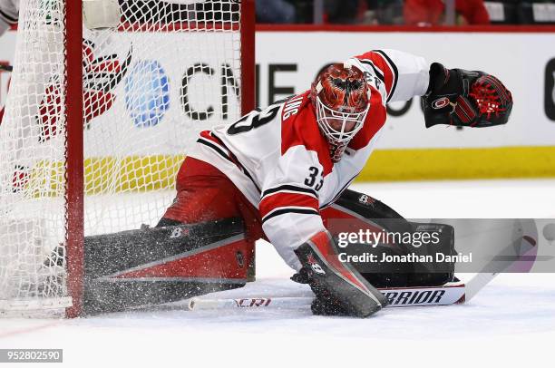 Scott Darling of the Carolina Hurricanes makes a save against the Chicago Blackhawks at the United Center on March 8, 2018 in Chicago, Illinois. The...