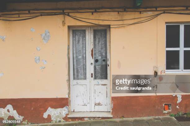 front view of a house with door and window - abandoned crack house stock pictures, royalty-free photos & images