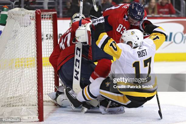 Jay Beagle of the Washington Capitals checks Bryan Rust of the Pittsburgh Penguins during the first period in Game Two of the Eastern Conference...