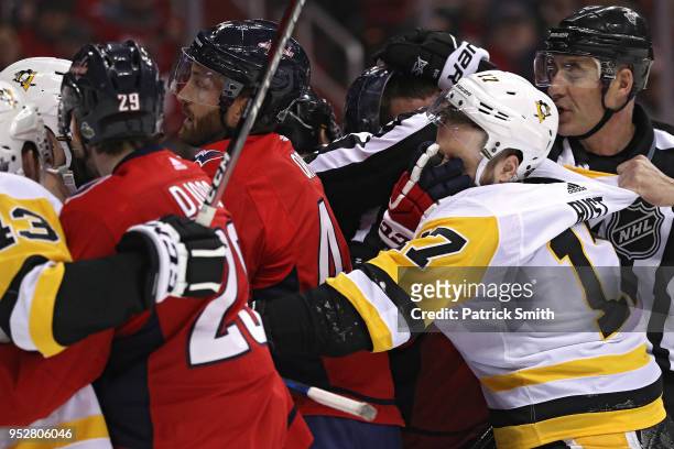 Bryan Rust of the Pittsburgh Penguins is face washed as teammates scrum with Washington Capitals players during the first period in Game Two of the...