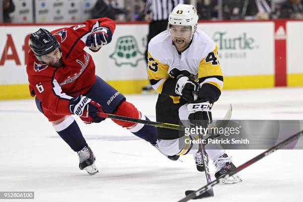 Conor Sheary of the Pittsburgh Penguins skates past Michal Kempny of the Washington Capitals during the first period in Game Two of the Eastern...