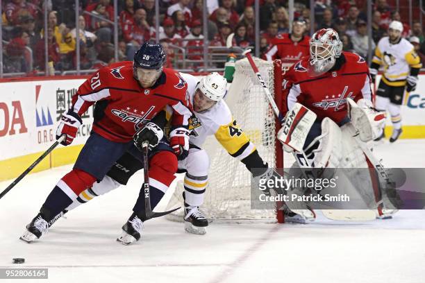 Lars Eller of the Washington Capitals skates past Conor Sheary of the Pittsburgh Penguins during the first period in Game Two of the Eastern...