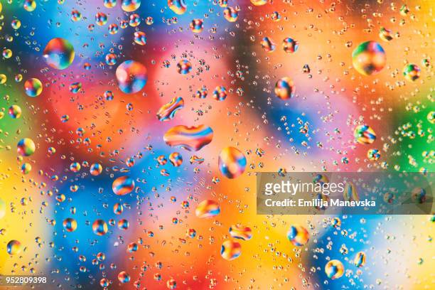 colorful water drops - water repellent stock pictures, royalty-free photos & images