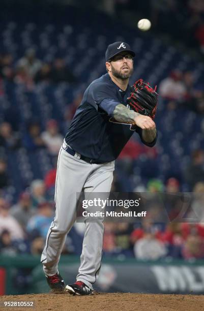 Peter Moylan of the Atlanta Braves throws the ball to first base against the Philadelphia Phillies at Citizens Bank Park on April 27, 2018 in...