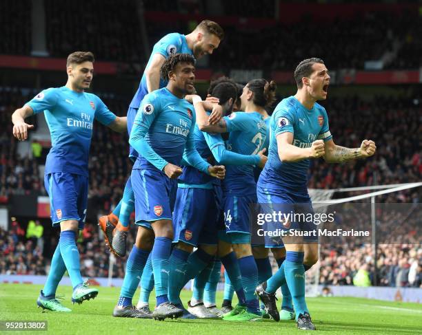 Granit Xhaka, Alex Iwobi, Calum Chambers and Konstantinos Mavropanos celebrate the Arsenal goal, scored by Henrikh Mkhitaryan during the Premier...