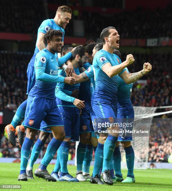 Granit Xhaka, Alex Iwobi, Calum Chambers and Konstantinos Mavropanos celebrate the Arsenal goal, scored by Henrikh Mkhitaryan during the Premier...