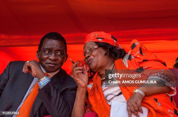 Malawi's former president Joyce Banda talks with her husband, former chief justice Richard Banda at a rally she held at her home village, at Domasi...