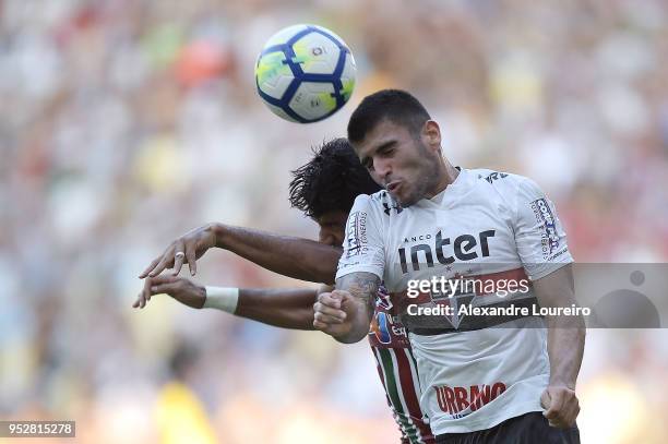 Gum of Fluminense struggles for the ball with Bruno Alves of Sao Paulo during the match between Fluminense and Sao Paulo as part of Brasileirao...