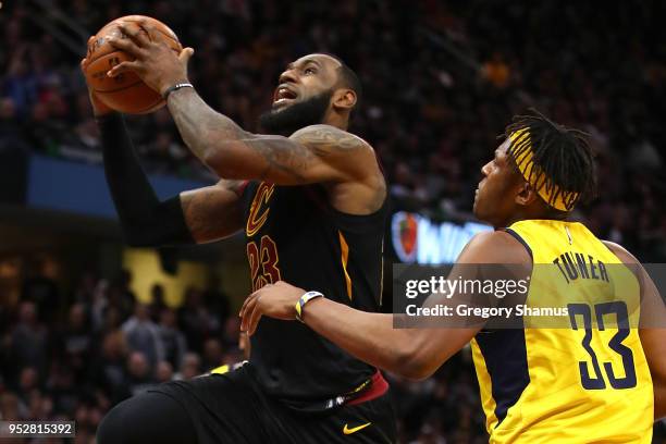 LeBron James of the Cleveland Cavaliers drives to the basket paste Myles Turner of the Indiana Pacers during the second half in Game Seven of the...