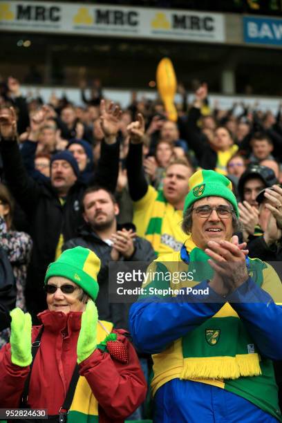 Norwich City fans celebrate victory after the Sky Bet Championship match between Norwich City and Leeds United at Carrow Road on April 28, 2018 in...