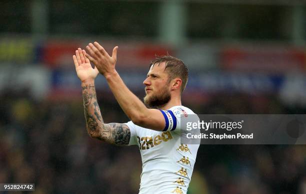 Liam Cooper of Leeds United applauds the traveling fans during the Sky Bet Championship match between Norwich City and Leeds United at Carrow Road on...