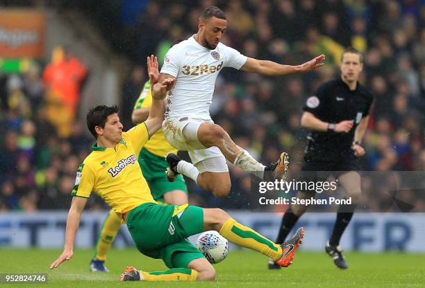 Kemar Roofe of Leeds United and Timm Close of Norwich City compete for the ball during the Sky Bet Championship match between Norwich City and Leeds...