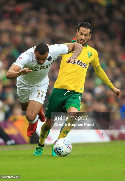 Mario Vrancic of Norwich City and Jay-Roy Grot of Leeds United compete for the ball during the Sky Bet Championship match between Norwich City and...