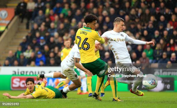 Ezgjan Alioski of Leeds United shoots under pressure from Jamal Lewis of Norwich City during the Sky Bet Championship match between Norwich City and...