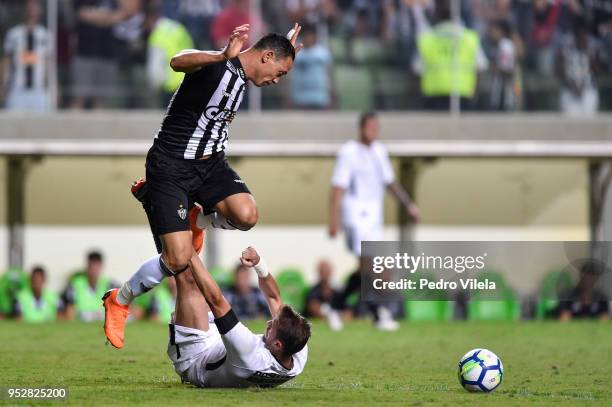 Ricardo Oliveira of Atletico MG and Henrique of Corinthians battle for the ball during a match between Atletico MG and Corinthians as part of...