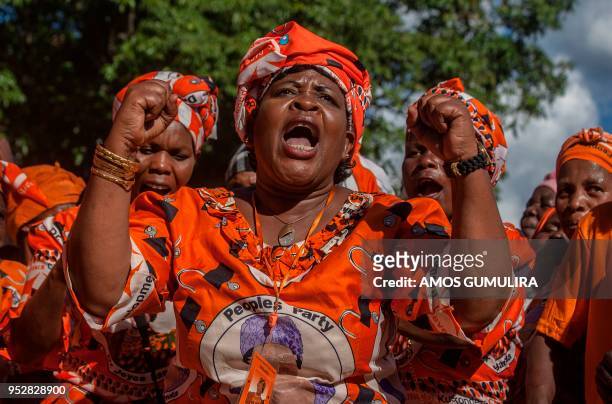 Supporters of Malawian People's Party and former Malawian President Joyce Banda cheer during a rally at her home town, a day after her return from a...