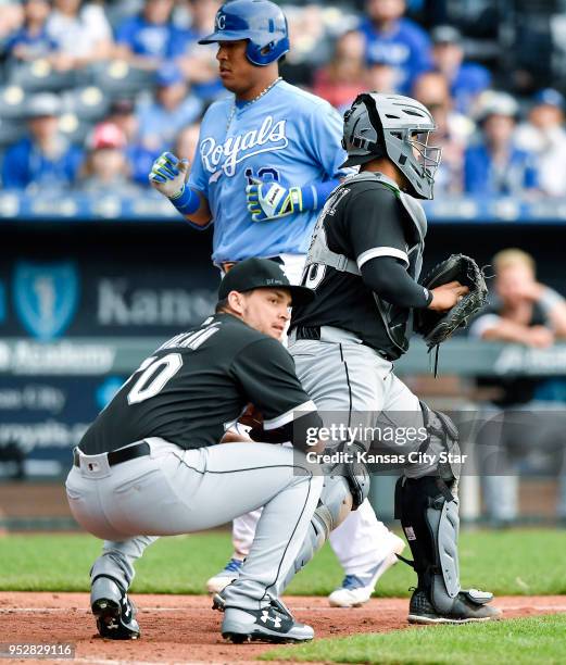 Kansas City Royals' Salvador Perez is forced out at home by Chicago White Sox catcher Omar Narvaez on a grounder to relief pitcher Luis Avilan by Jon...