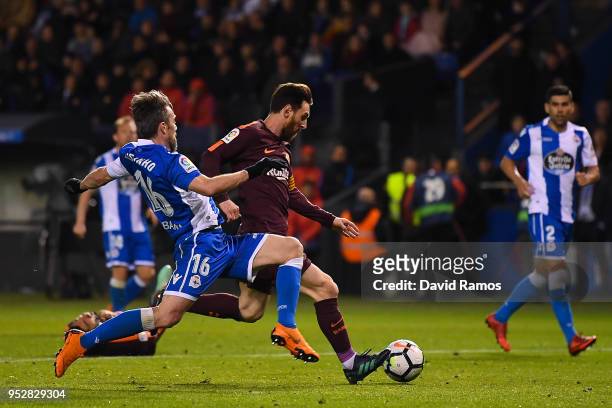 Lionel Messi of FC Barcelona scores his team's fourth goal past Luisinho Correia of RC Deportivo La Coruna during the La Liga match between Deportivo...