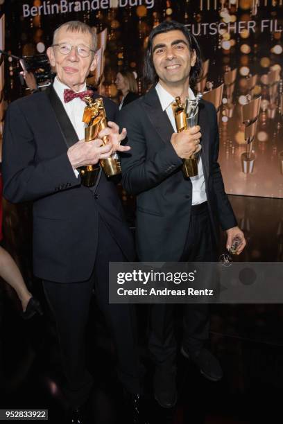 Hark Bohm and Fatih Akin pose with their awards after the Lola - German Film Award show at Messe Berlin on April 27, 2018 in Berlin, Germany.