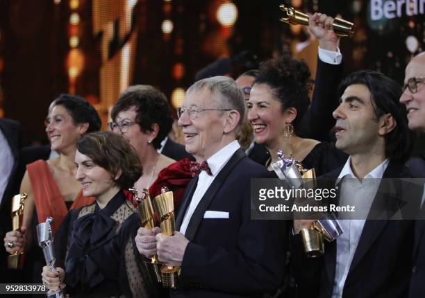 Hark Bohm with Fatih Akin and other winners pose with their awards after the Lola - German Film Award show at Messe Berlin on April 27, 2018 in...
