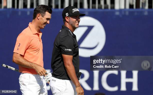 Billy Horschel reacts with teammate Scott Piercy on the 18th hole during the final round of the Zurich Classic at TPC Louisiana on April 29, 2018 in...