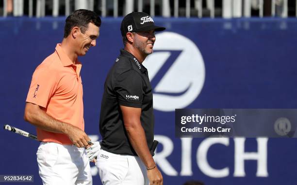 Billy Horschel reacts with teammate Scott Piercy on the 18th hole during the final round of the Zurich Classic at TPC Louisiana on April 29, 2018 in...