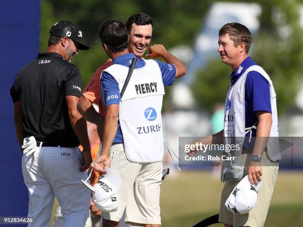 Billy Horschel reacts with teammate Scott Piercy on the 18th hole during the final round of the Zurich Classic at TPC Louisiana on April 29, 2018 in...