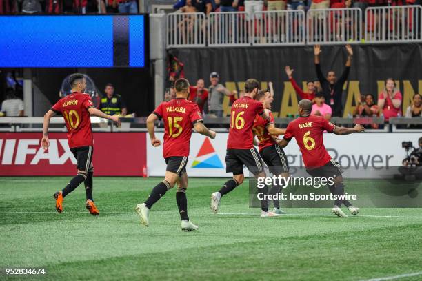 Kevin Kratz of Atlanta United celebrates with Darlington Nagbe , Chris McCann , Hector Villalba and Miguel Almiron of Atlanta United during an MLS...