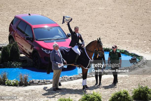 Oliver Townend riding Cooley Master Class wins the first Land Rover Kentucky Three Day Event and is presented with the winners trophy at the Kentucky...