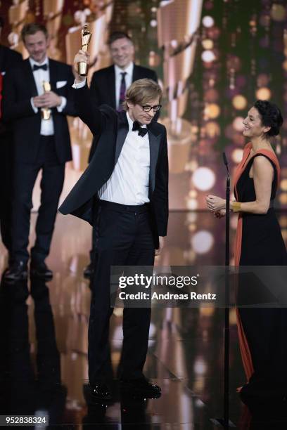 Karsten Stoeter reacts to winning the gold award 'Best Picture' for the movie '3 Tage in Quiberon' on stage during the Lola - German Film Award show...