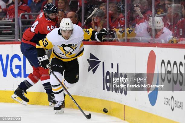 Conor Sheary of the Pittsburgh Penguins and Brooks Orpik of the Washington Capitals battles for the puck in the second period in Game Two of the...