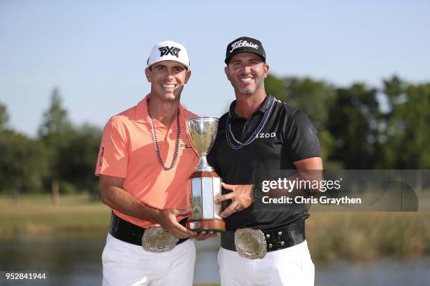Billy Horschel and Scott Piercy pose with the trophy and commerative belts during the final round of the Zurich Classic at TPC Louisiana on April 29,...